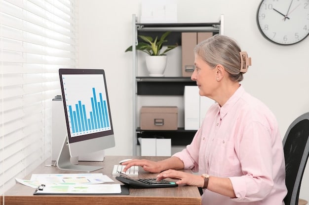 A person using a financial calculator with charts and graphs displayed on a computer screen in the background, symbolizing careful calculation and financial planning for retirement.