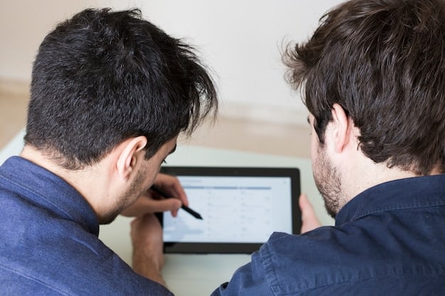 A split-screen image showing a person diligently researching service rates on a laptop on one side and a friendly, confident smile on their face as they engage in a phone conversation on the other side, symbolizing thorough preparation before negotiation.