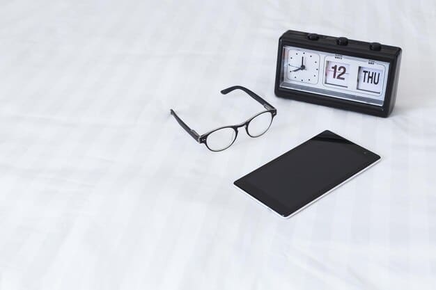 An alarm clock with the snooze button highlighted, next to eyeglasses and a book on a nightstand, suggesting the challenge of waking up early.