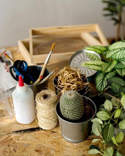 A detailed shot of various essential materials for a DIY house number planter project laid out on a workbench. The materials include wooden boards, house numbers, potting soil bags, a trowel, and various hand tools, showcasing the components needed to complete the project.