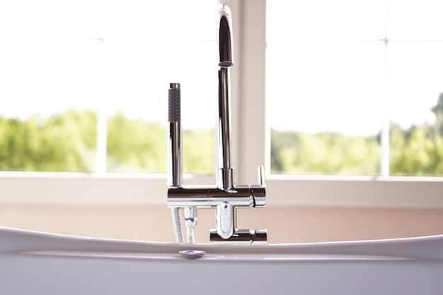 A detailed shot of new, stylish hardware being installed on a freshly painted bathroom vanity drawer. The focus is on the contrast between the old and new hardware, highlighting the impact of this small upgrade.