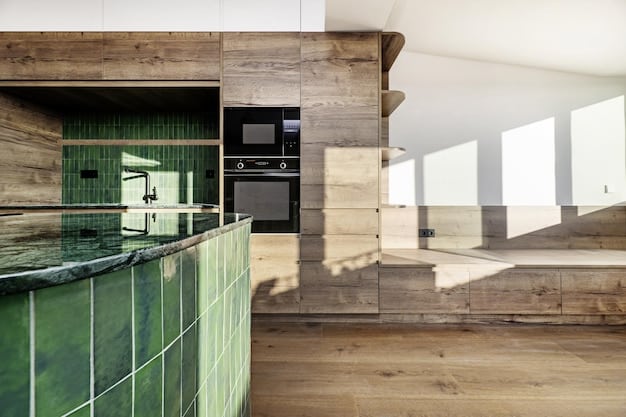 A modern kitchen featuring cabinetry made from reclaimed wood, countertops made from recycled glass, and energy-efficient appliances with a focus on natural light.