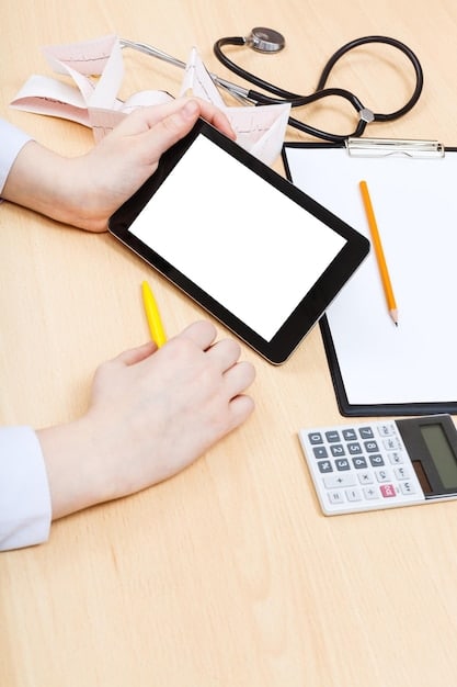 A person reviewing different healthcare plan options on a tablet, surrounded by documents and a calculator, symbolizing the importance of comparing and selecting the right plan.